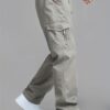 Men'S Korean-Style Cargo Pants Made of Fabric, Featuring Multiple Pockets And a Loose Fit. They Have an Elastic Waistband with a Drawstring, Making Them Suitable for Casual Everyday Wear in Spring And Summer
