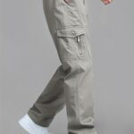 product-fancy-35d51ad6-2ee0-4850-85cf-0c3384bd8564 Men'S Korean-Style Cargo Pants Made of Fabric, Featuring Multiple Pockets And a Loose Fit. They Have an Elastic Waistband with a Drawstring, Making Them Suitable for Casual Everyday Wear in Spring And Summer