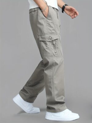 Men'S Korean-Style Cargo Pants Made of Fabric, Featuring Multiple Pockets And a Loose Fit. They Have an Elastic Waistband with a Drawstring, Making Them Suitable for Casual Everyday Wear in Spring And Summer