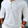 [ROYALBOY] Presents a New Spring Collection Featuring a Stylish And Casual Long-Sleeve Henley Shirt for Men. It Has a Half-Button Placket And a Vintage Button Design